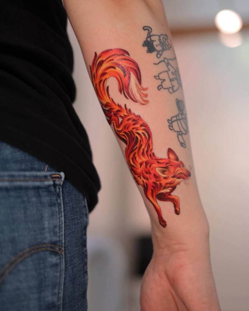 Illustrative style fox tattoo located on the wrist.