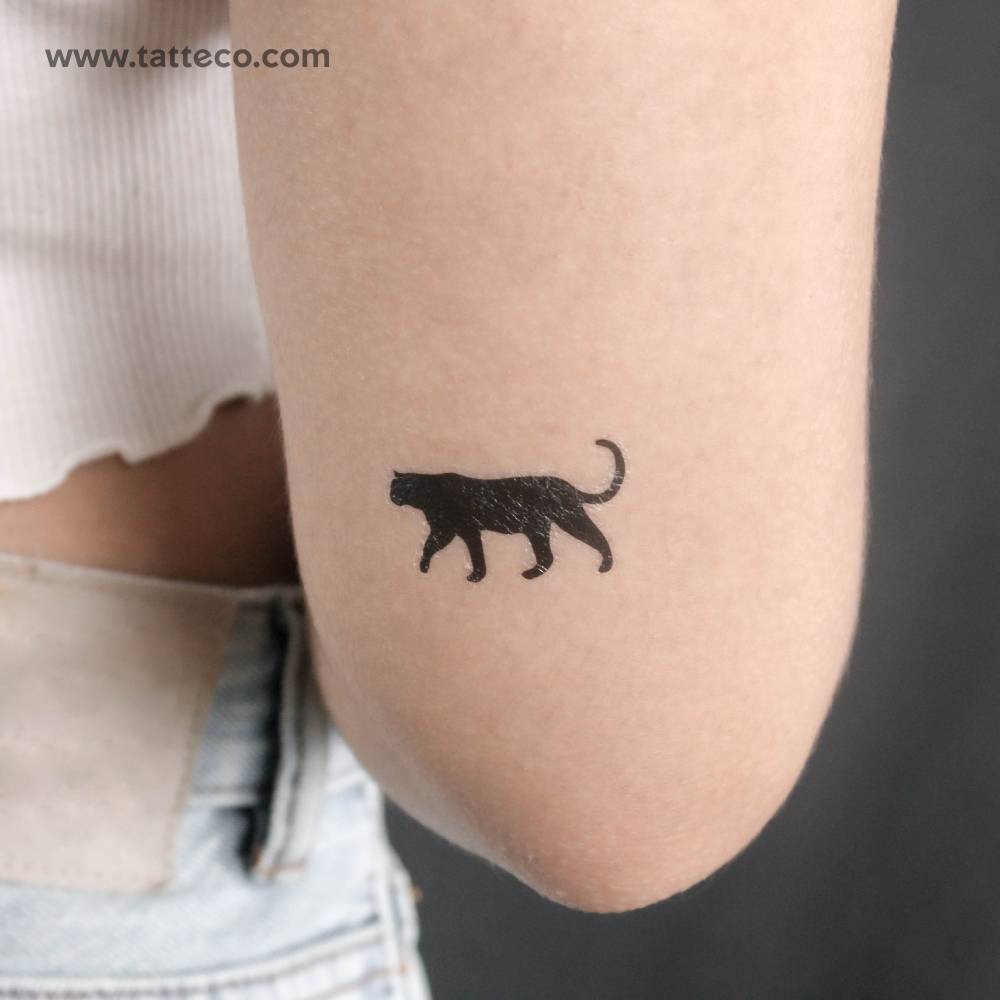 Black panther temporary tattoo located on the tricep.