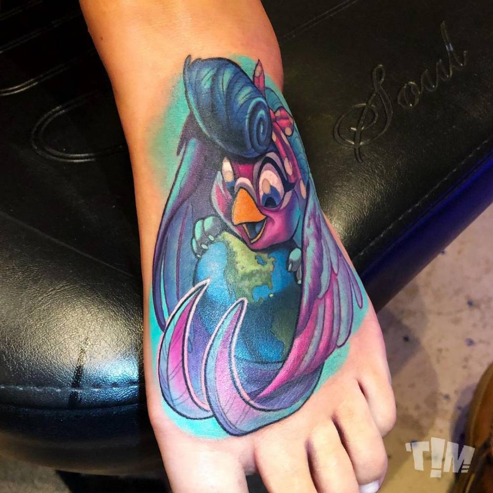 New school bird tattoo on the foot.