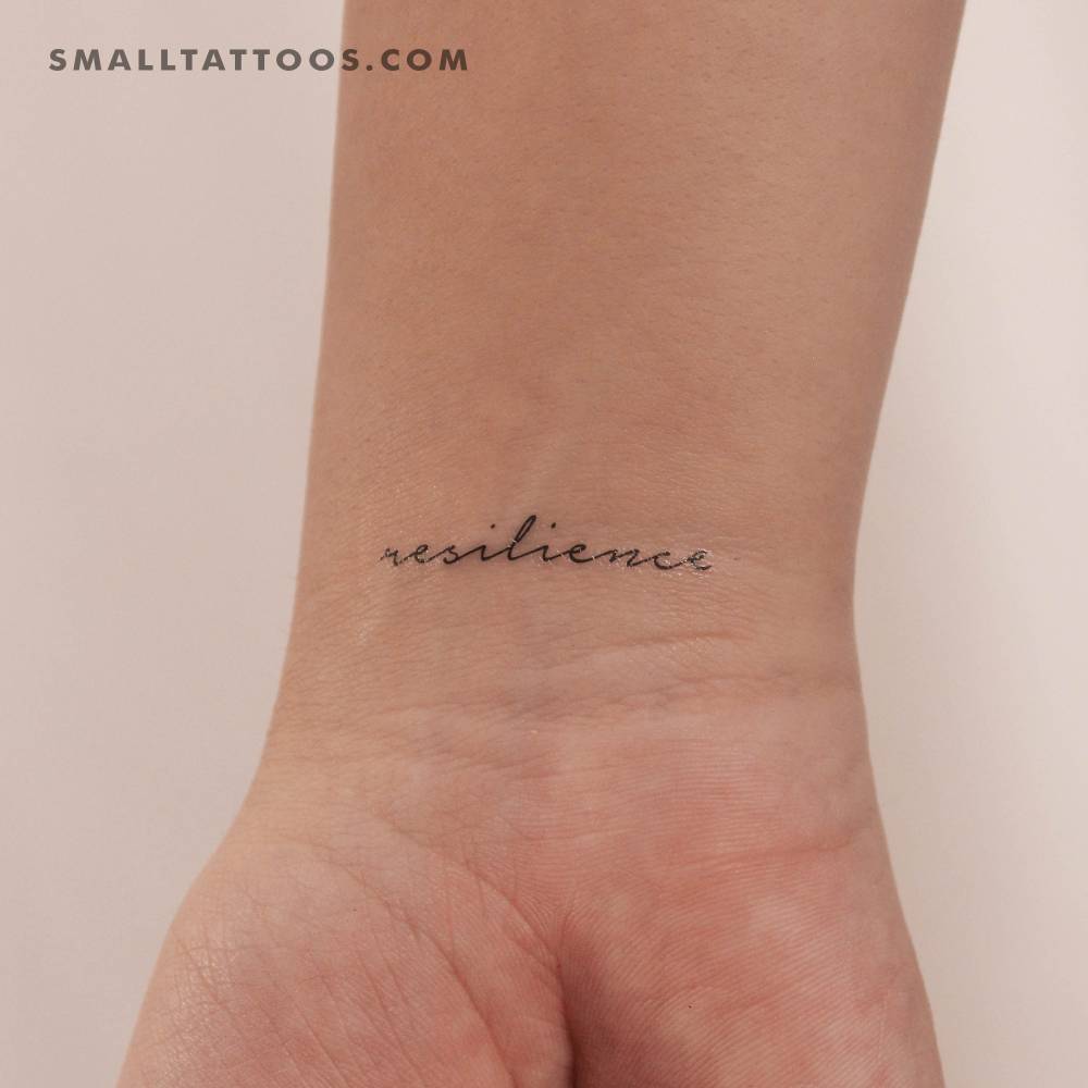 Word "resilience" temporary lettering tattoo located on the wrist.
