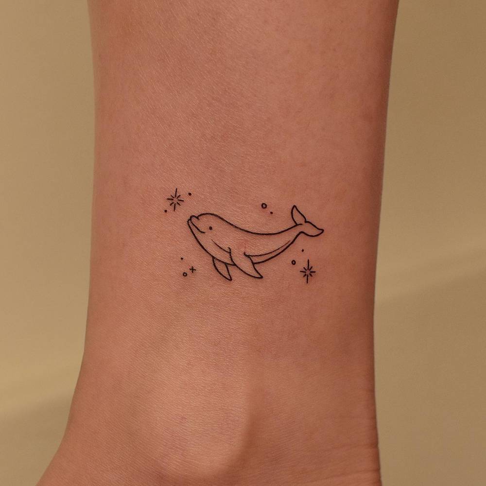 Minimalistic dolphin tattoo done on the ankle.