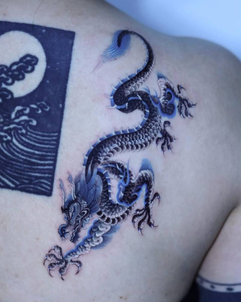 Dragon tattoo in Japanese style located on the shoulder blade.