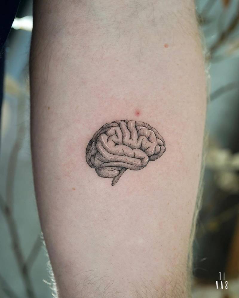 Brain tattoo located on the inner forearm.