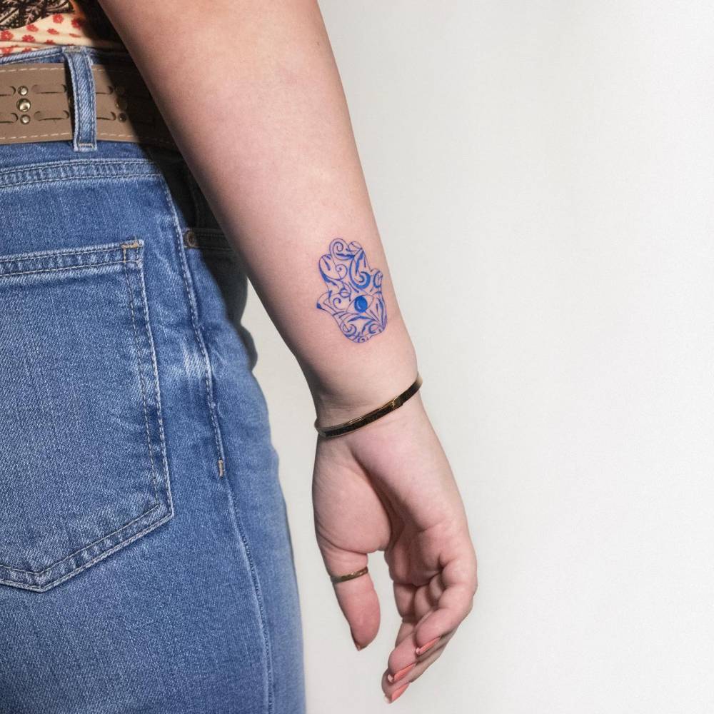 Little delftware Hamsa tattoo done on the wrist.