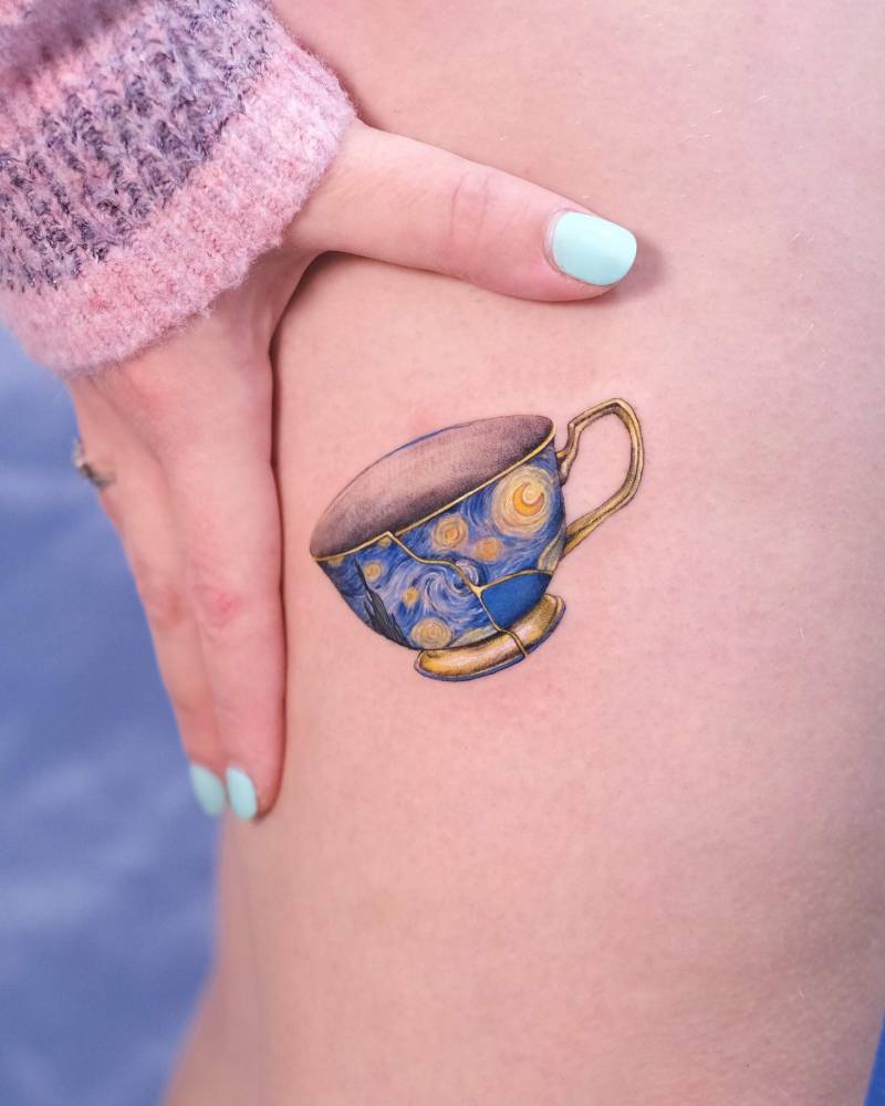 Kintsugi 'The Starry Night' teacup tattoo located on the thigh.