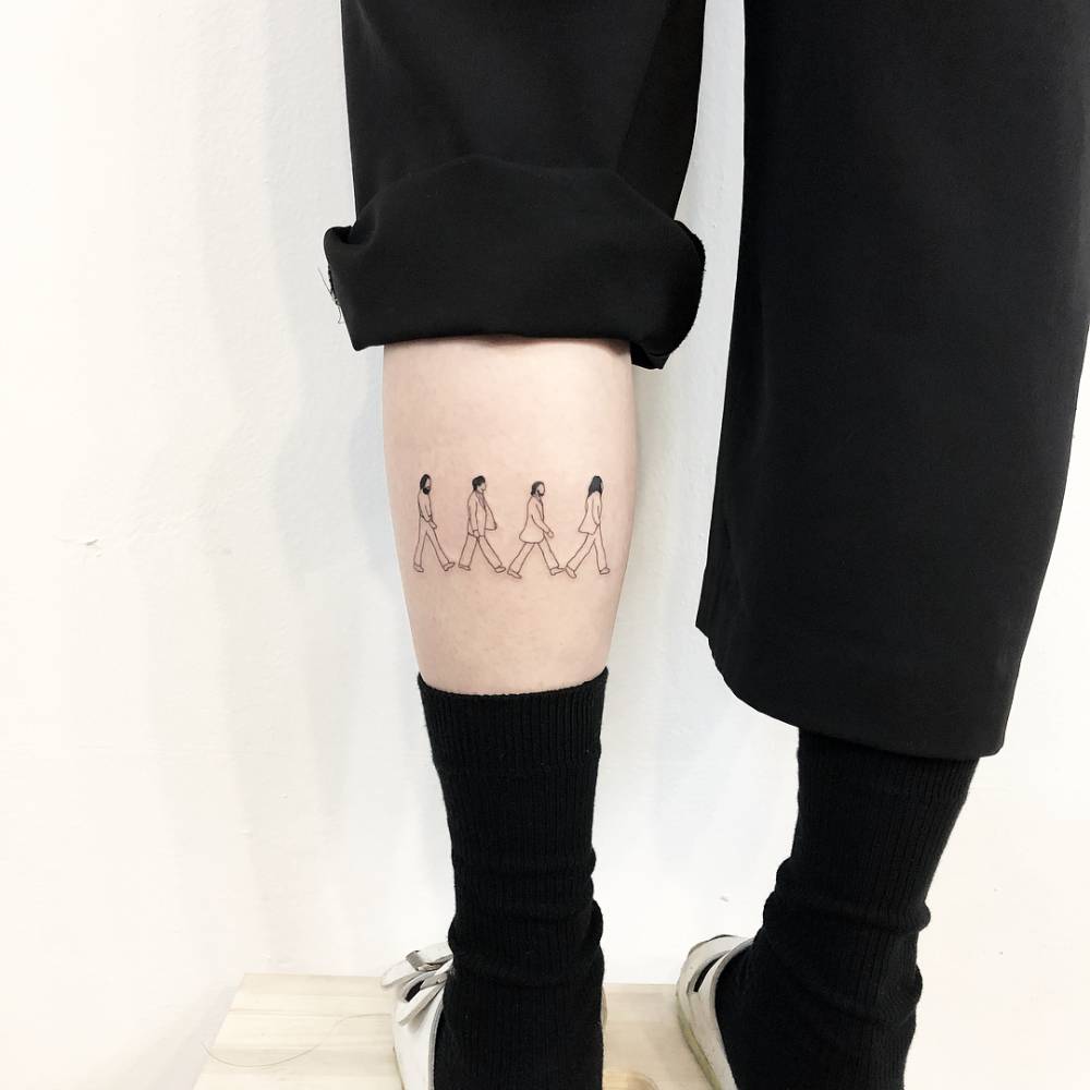 Abbey Road tattoo located on the calf.