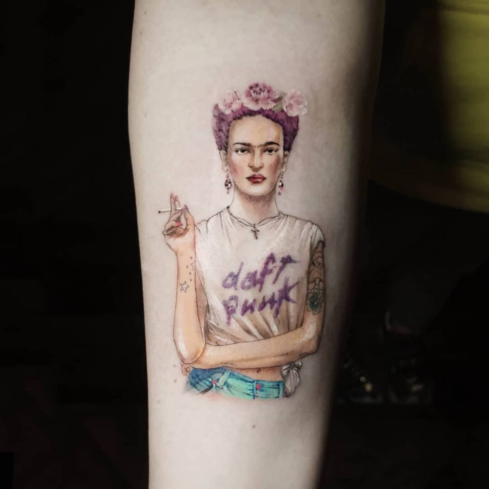 Frida Kahlo wearing a Daft Punk t-shirt tattooed on the inner forearm.
