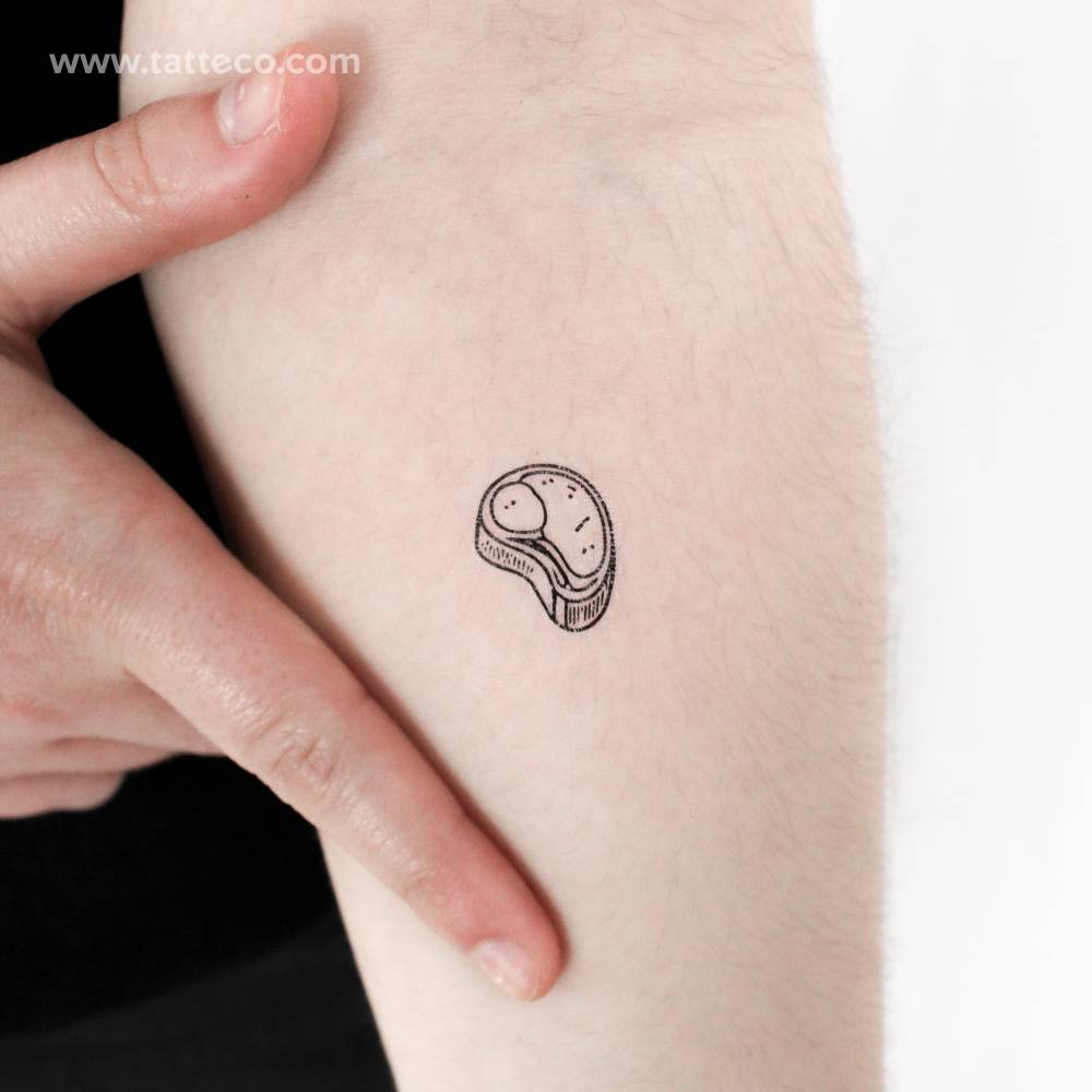 Steak temporary tattoo located on the inner forearm.