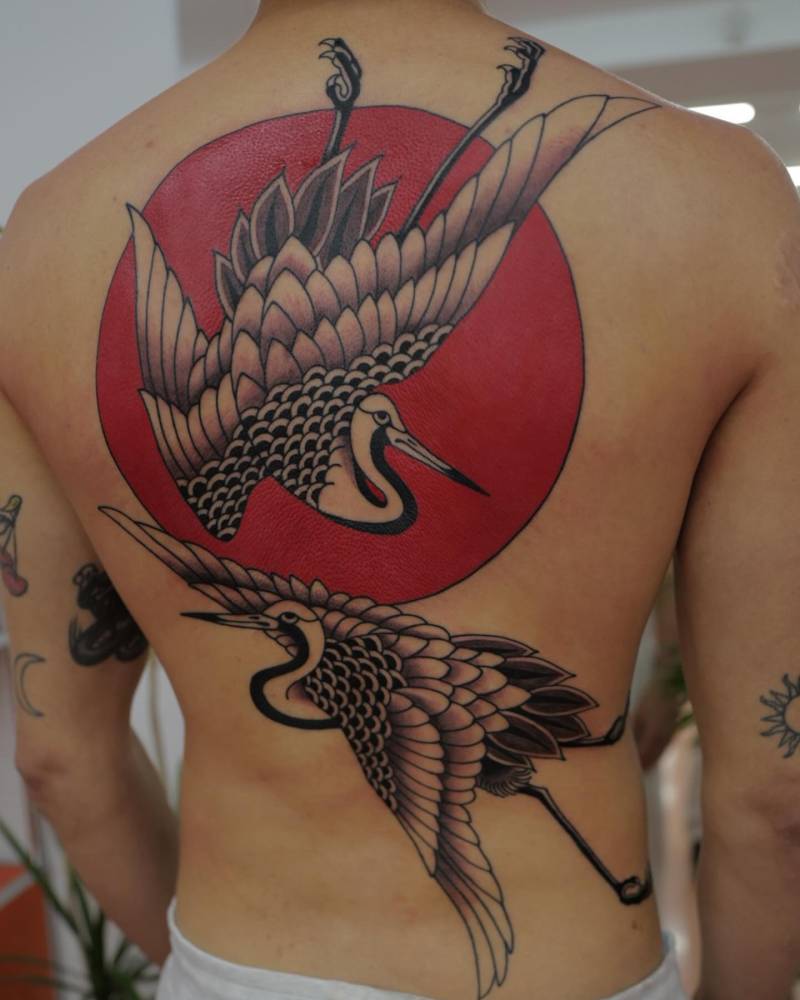Traditional style crane backpiece tattoo.