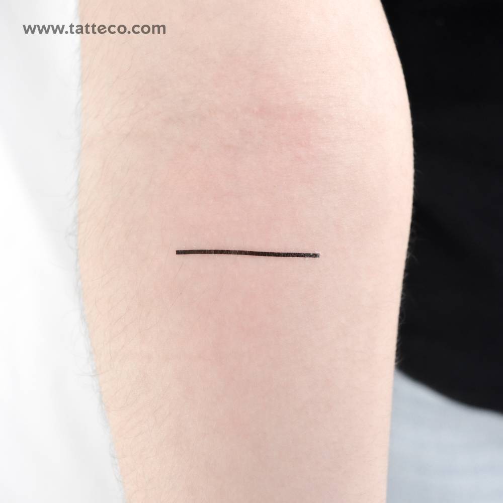 Minimalistic line temporary tattoo placed on the inner forearm.
