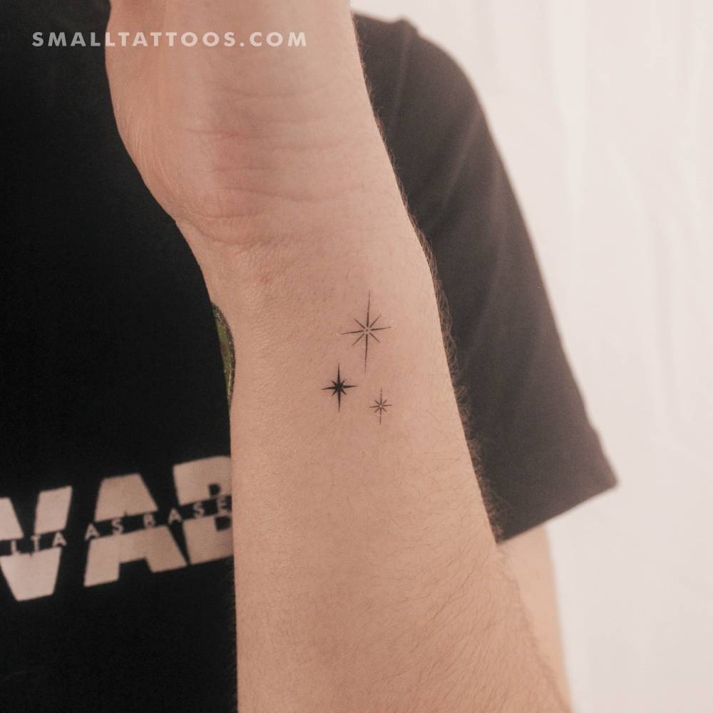 Three sparkles temporary tattoo placed on the wrist.