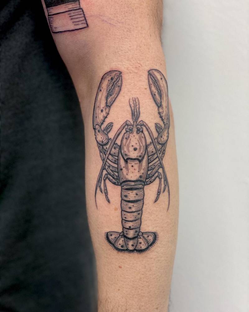 Lobster tattoo located on the forearm.