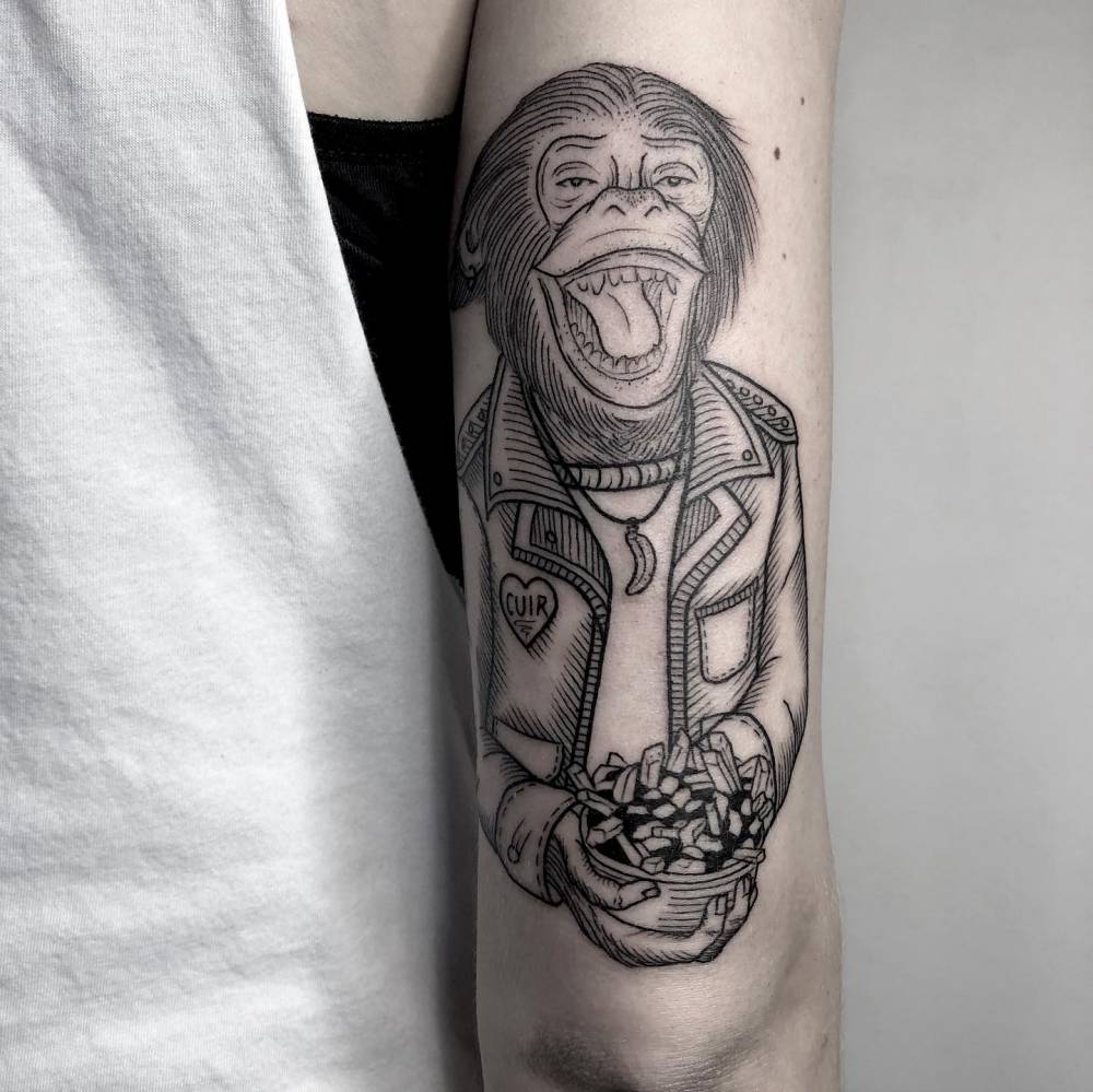 Monkey portrait tattoo done on the tricep.