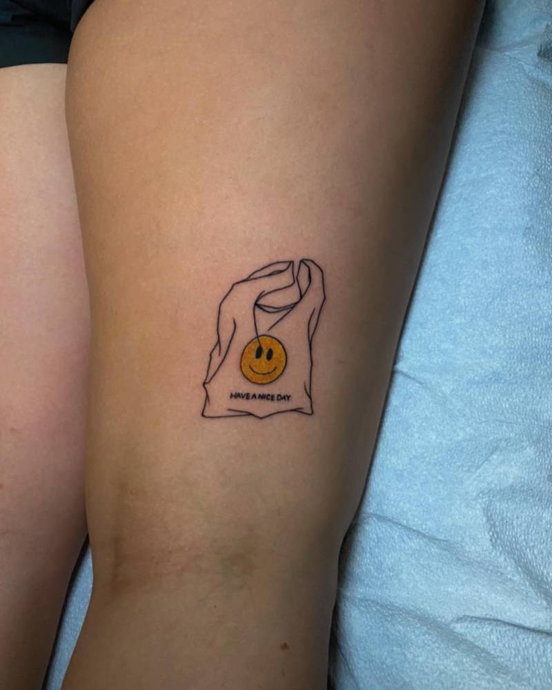 Plastic bag tattoo located on the thigh.