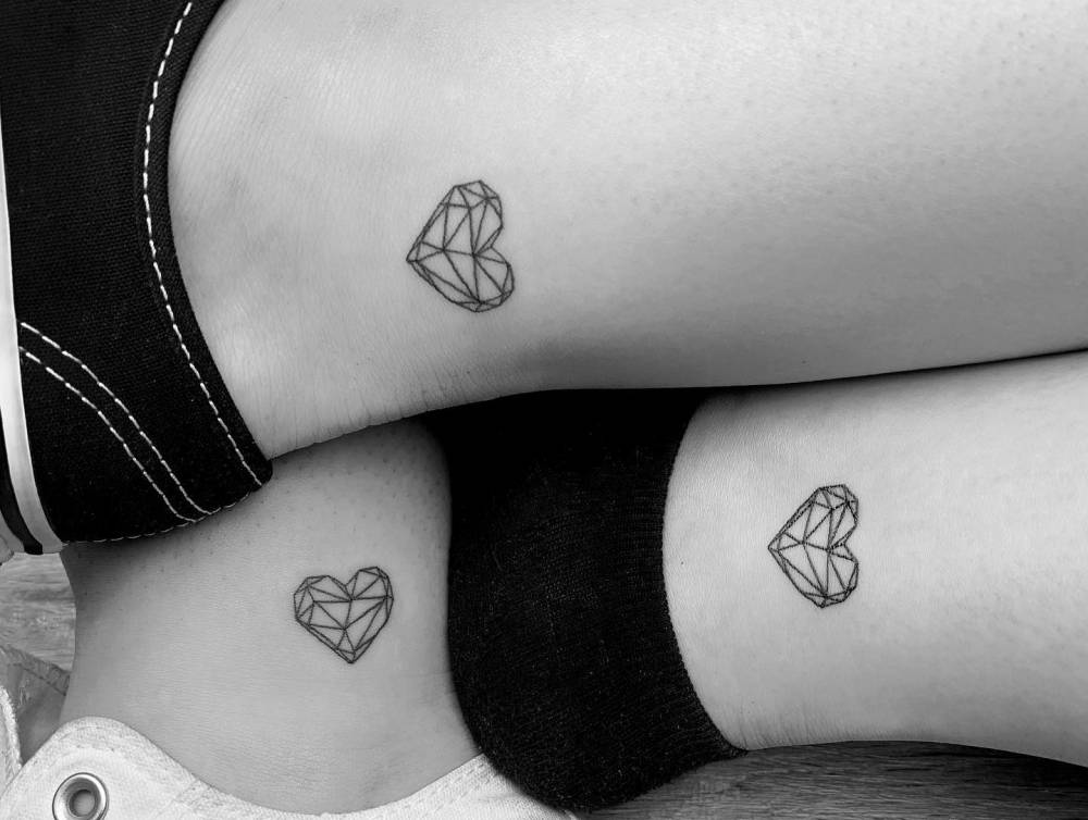 Matching low poly heart tattoo for best friends.