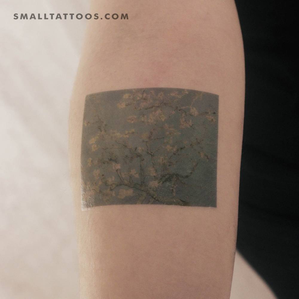 'Almond Blossoms' temporary tattoo located on the inner forearm.