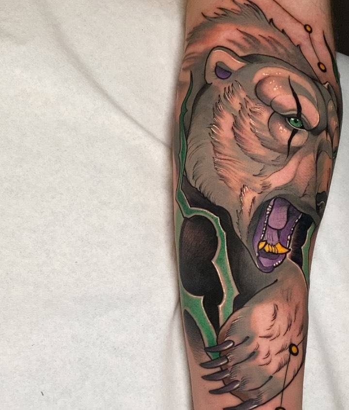 Neotraditional polar bear portrait tattoo on the inner forearm.