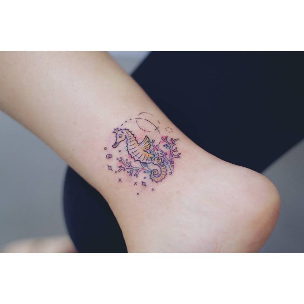 Seahorse tattoo located on the ankle, done in illustrative style.