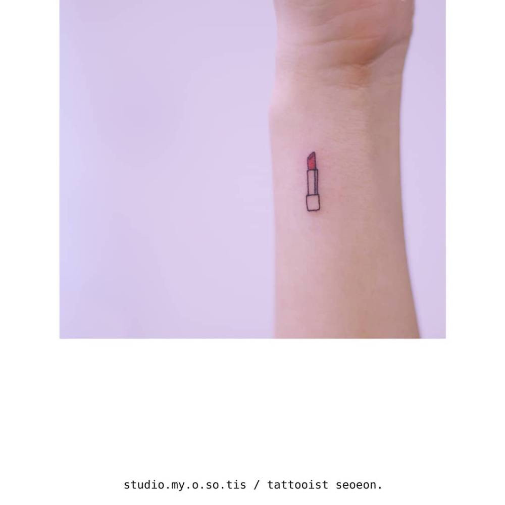 Minimalistic little lipstick tattoo located on the wrist.