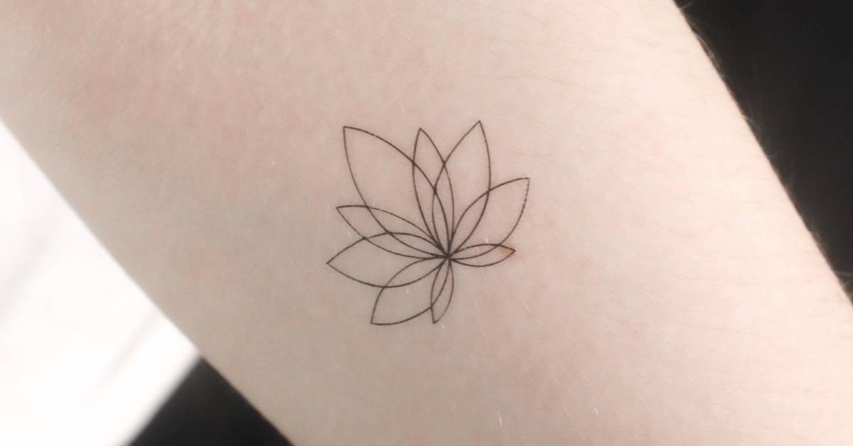 Fine line style lotus flower temporary tattoo located
