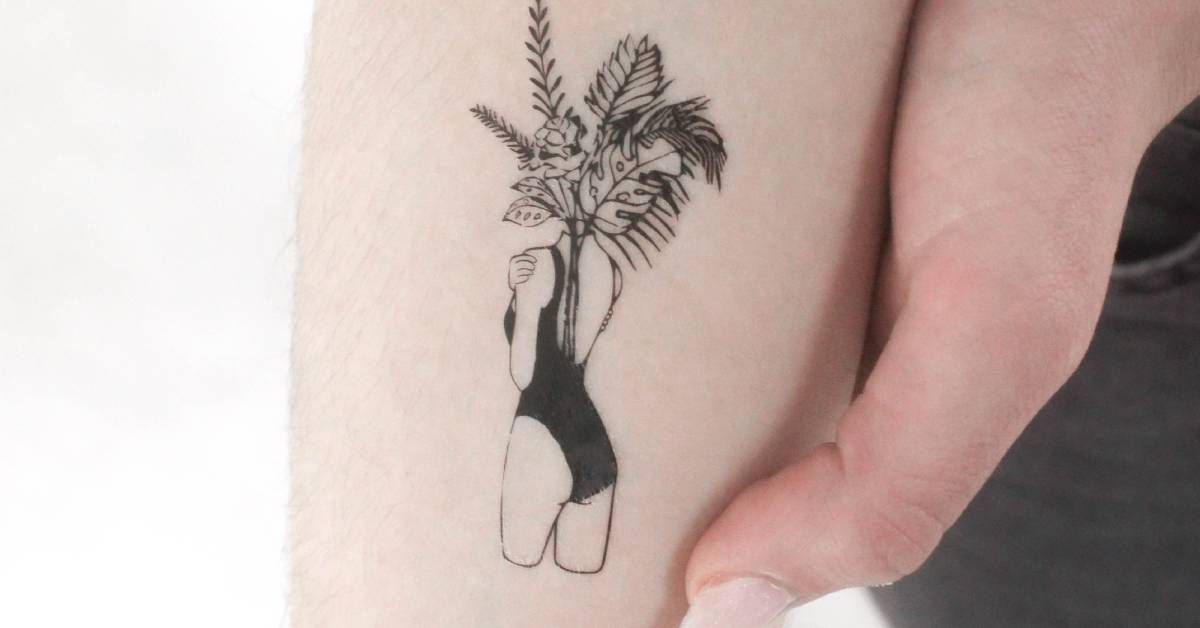 Flower head woman temporary tattoo located on the inner