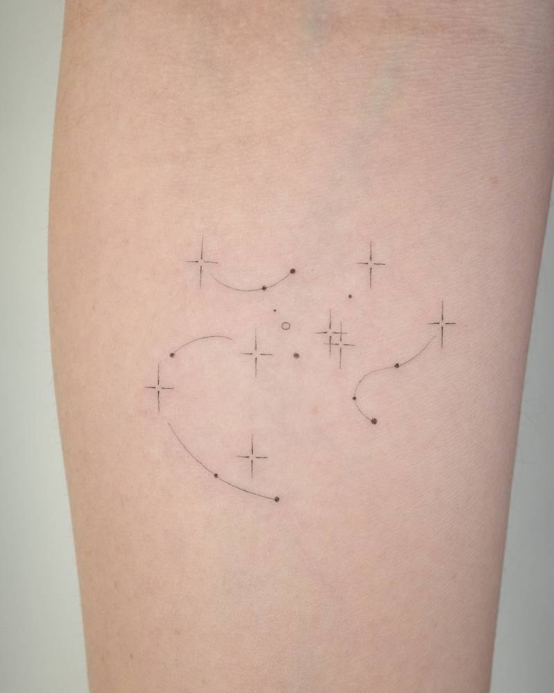 Minimalistic style Sagittarius constellation tattoo done on the inner forearm.