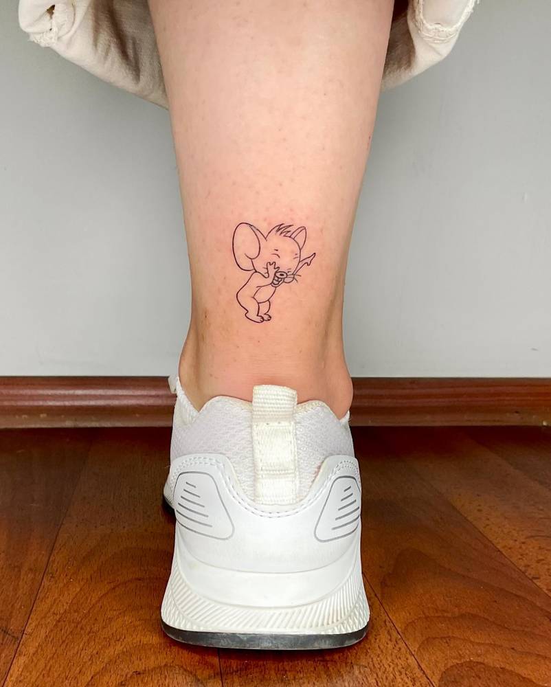 Jerry tattoo located on the achilles, fine line style.
