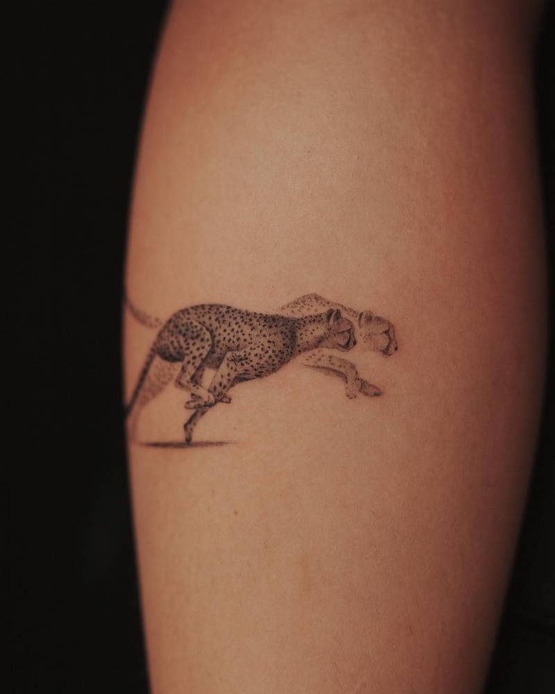 Micro-realistic style cheetah tattoo done on the calf.