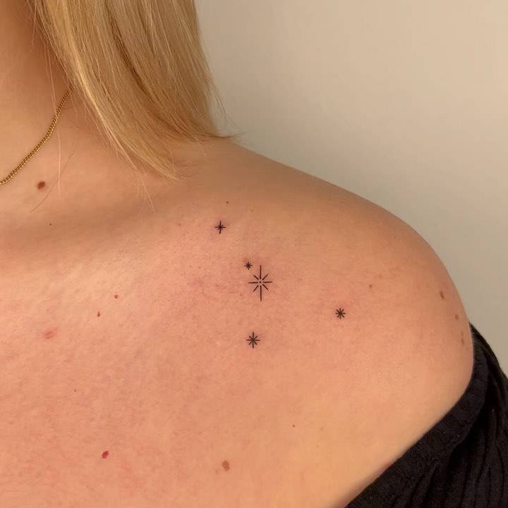Minimalistic style Cancer constellation tattooed on the shoulder.