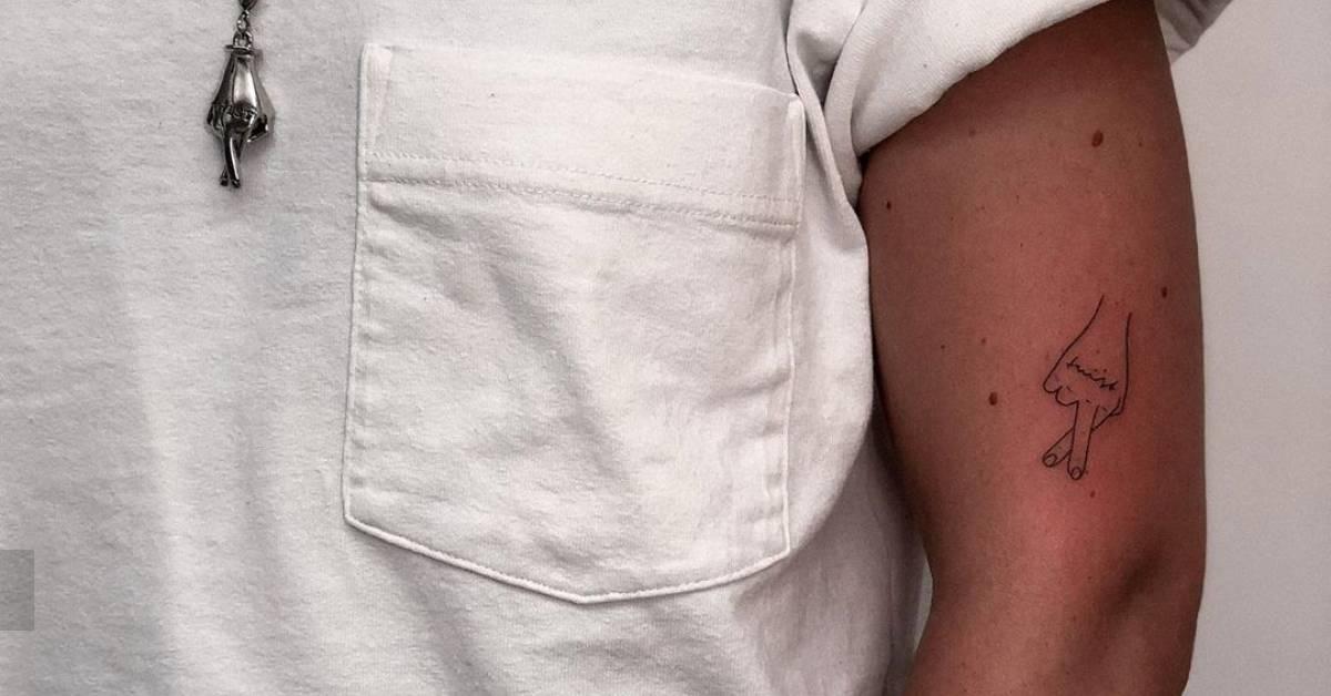 Minimalistic style crossed fingers tattoo hand poked on