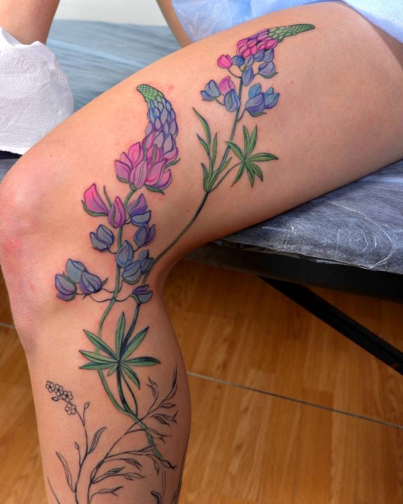 Lupines tattoo in illustrative style located on the leg.