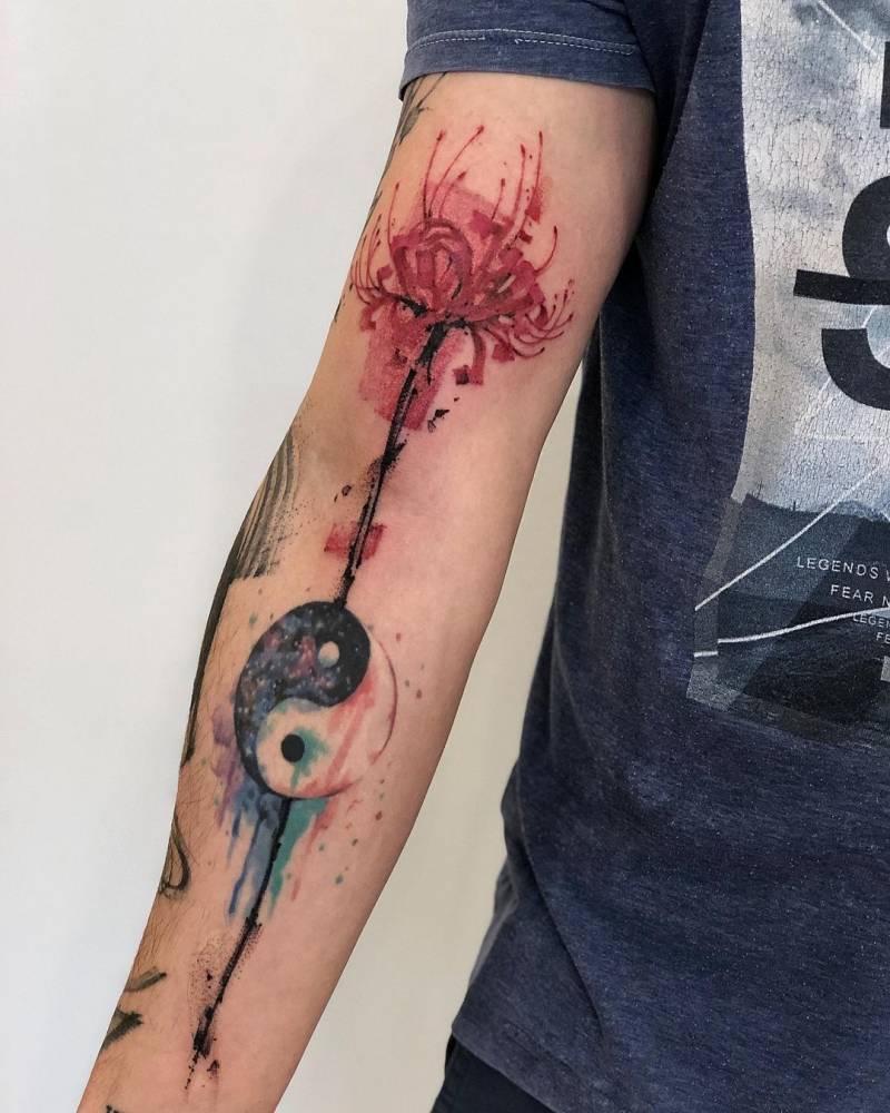 Freehand red spider lily and yin yang tattoo on the bicep