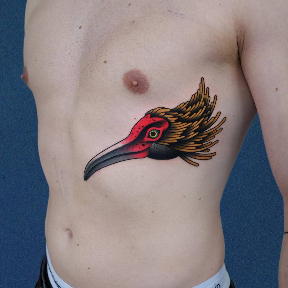 Neotraditional style crane portrait tattoo located on the rib.