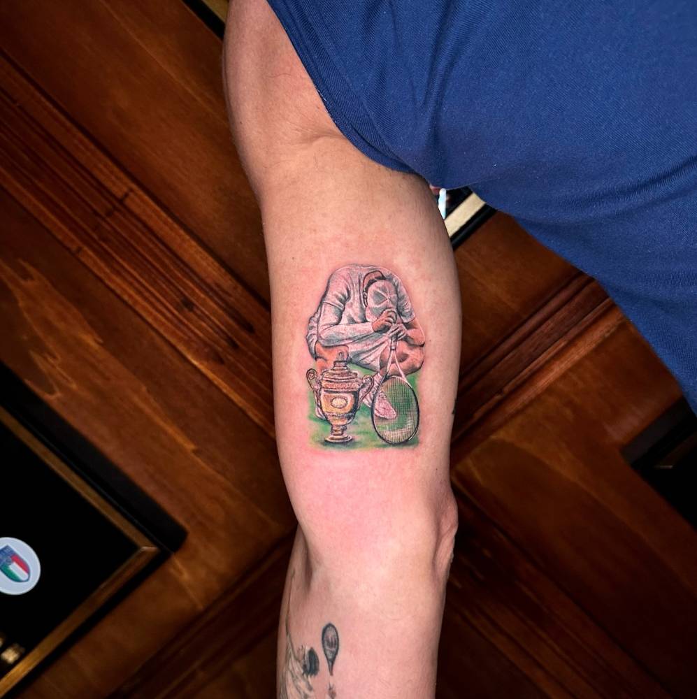 Jannik Sinner tattoo in illustrative style located on the inner arm.