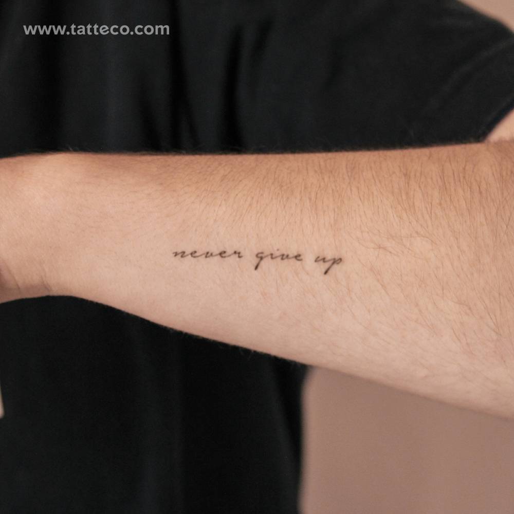 "Never give up" semi-permanent tattoo located on the wrist.