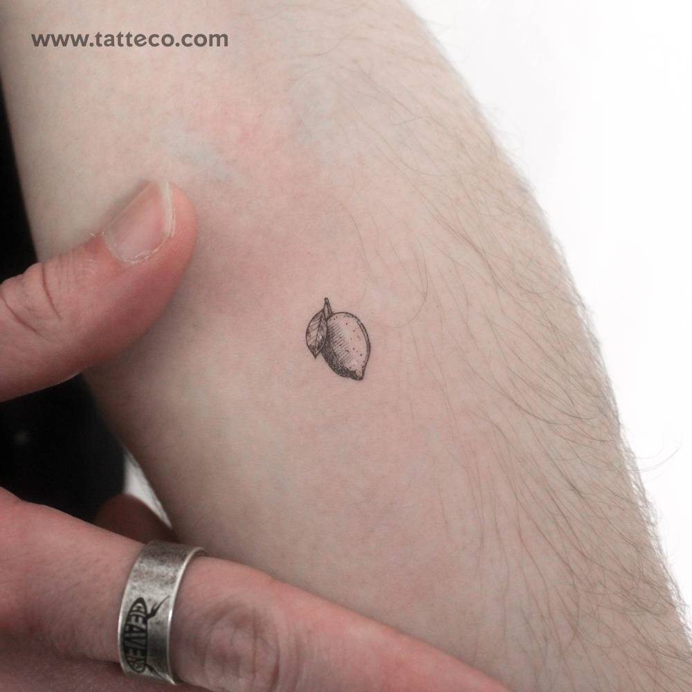 Little lemon temporary tattoo located on the inner forearm.
