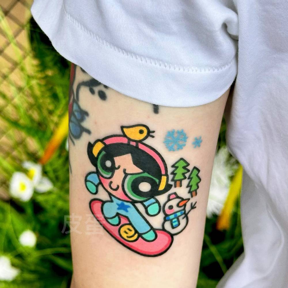 Buttercup tattoo in cartoon style located on the upper arm.