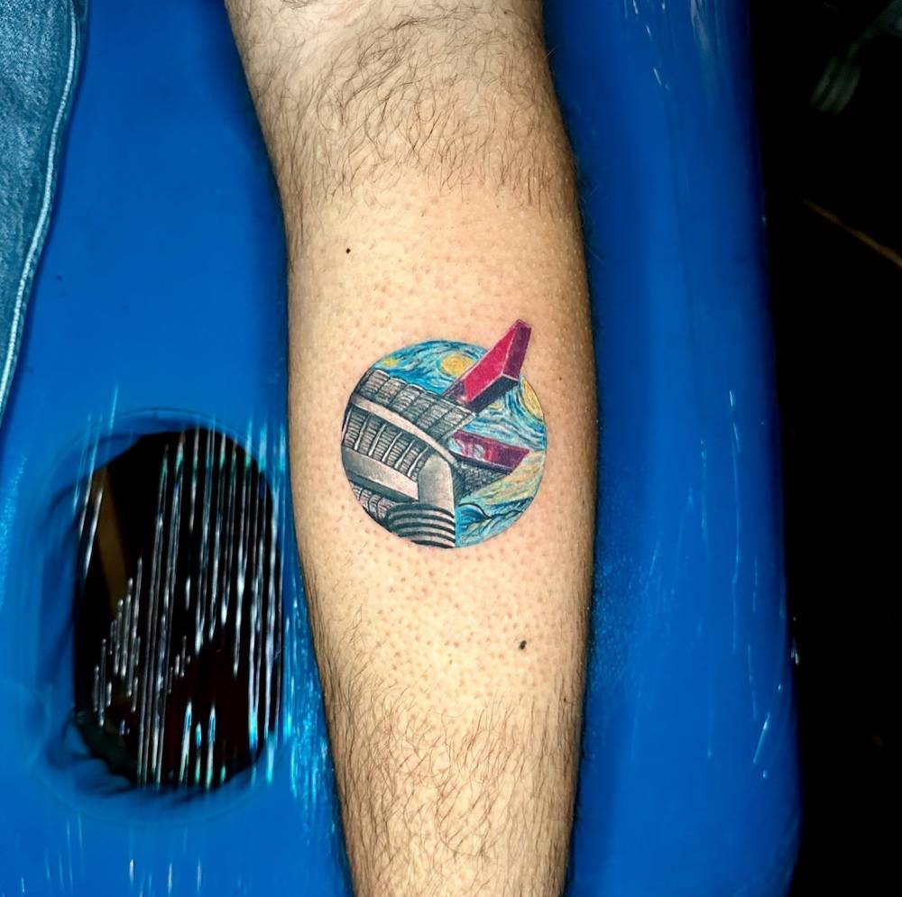 San Siro x Starry Night tattoo in illustrative style located on the calf.