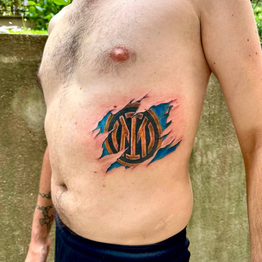 Inter Milan tattoo in realistic style located on the rib.