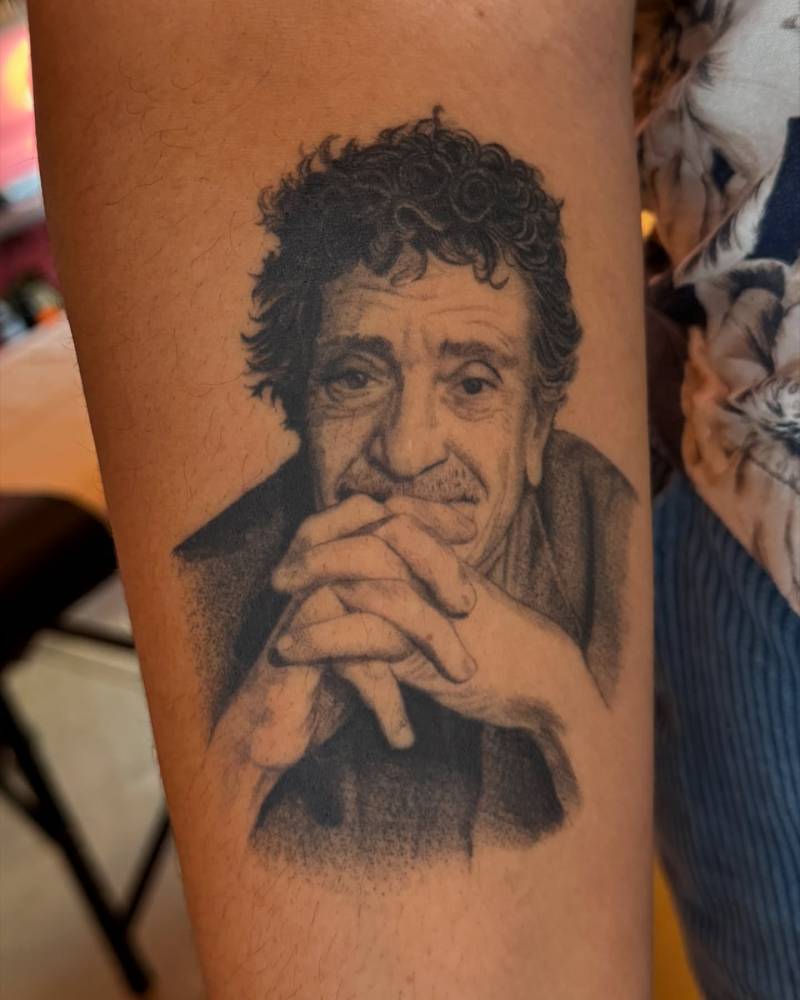 Healed Kurt Vonnegut tattoo in black and grey style located on the inner forearm.