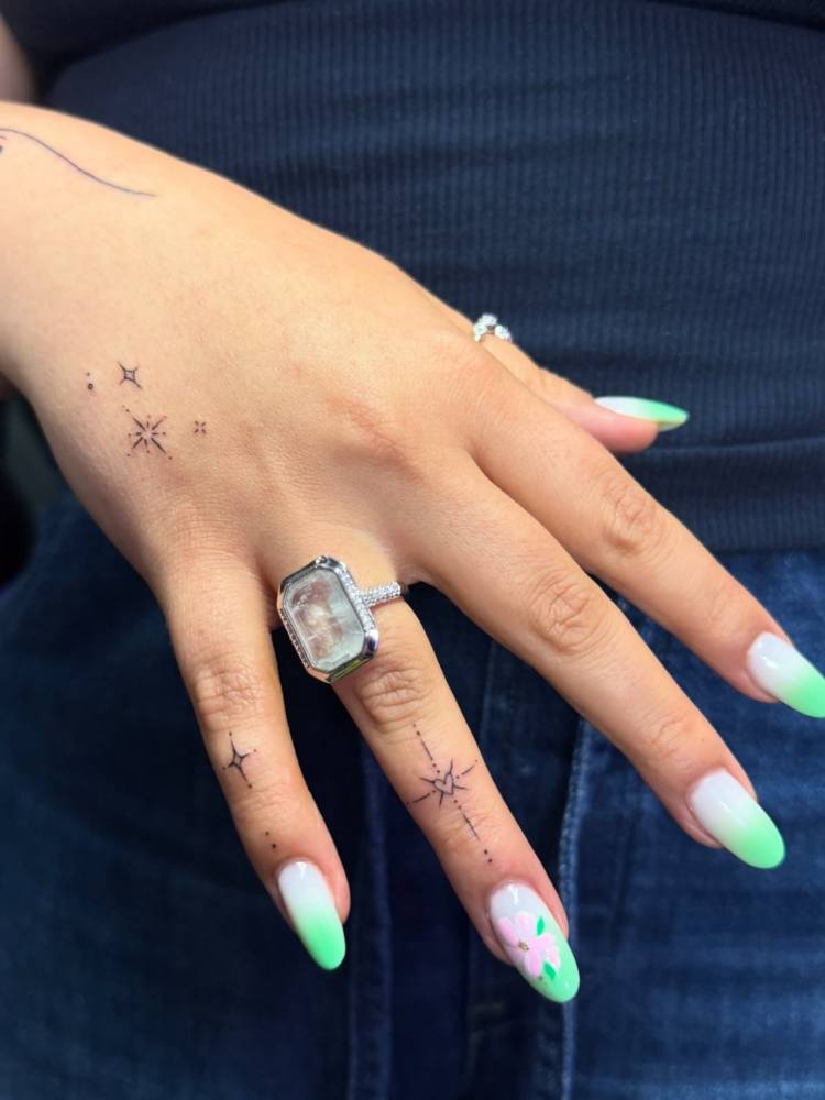 Stars collection tattooed on the hand and fingers.