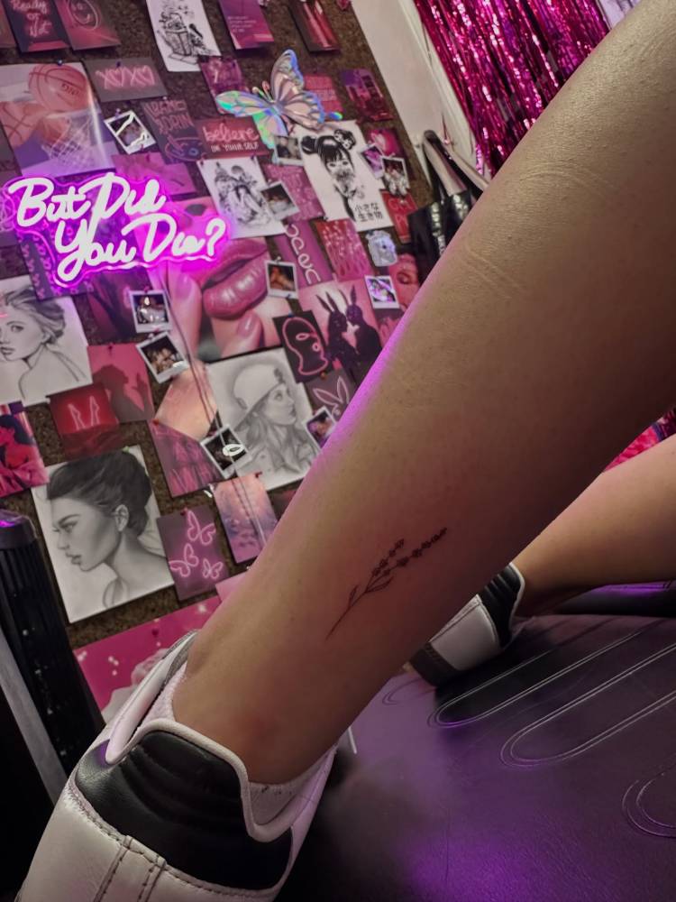 Little minimalistic lavender tattoo placed on the achilles.