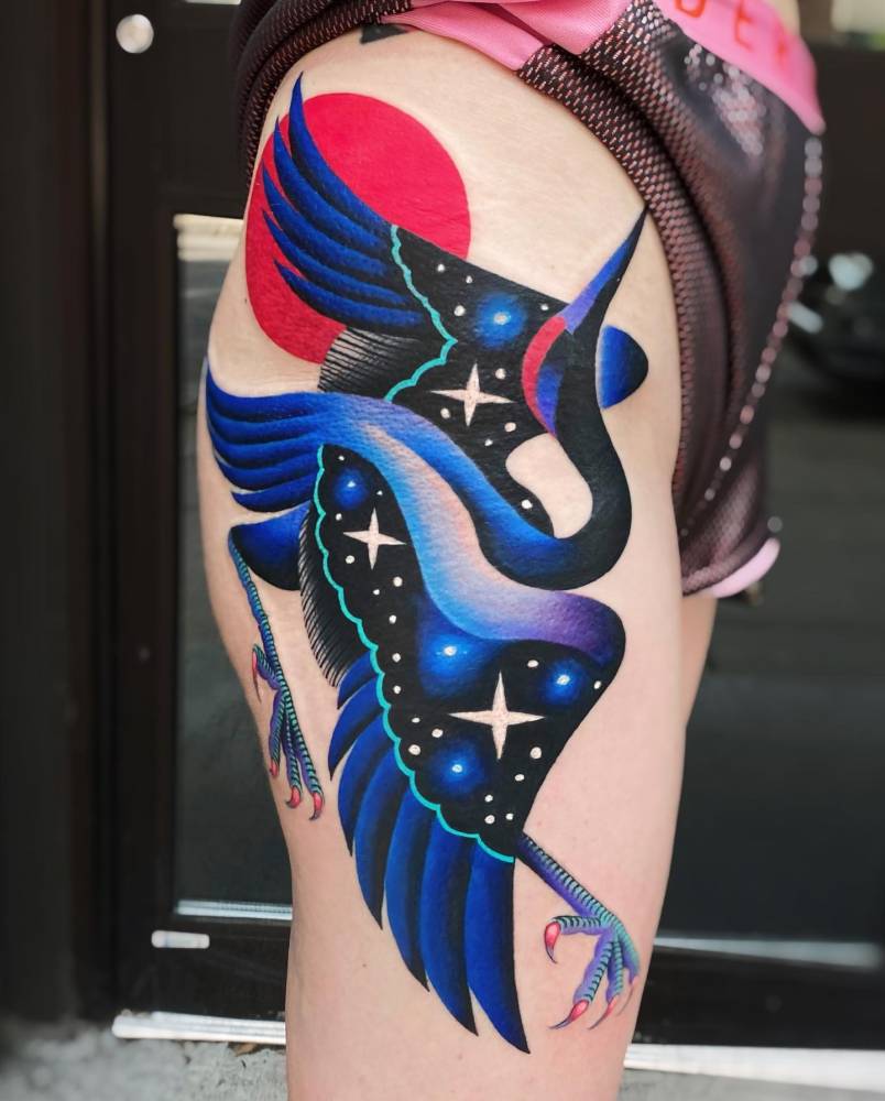 Crane tattoo located on the hip, done in pop art style.