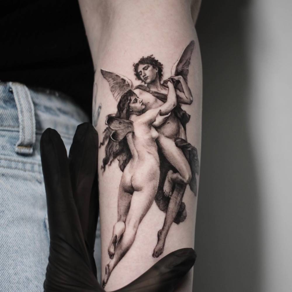 'L'amour et Psyche' tattoo located on the forearm.