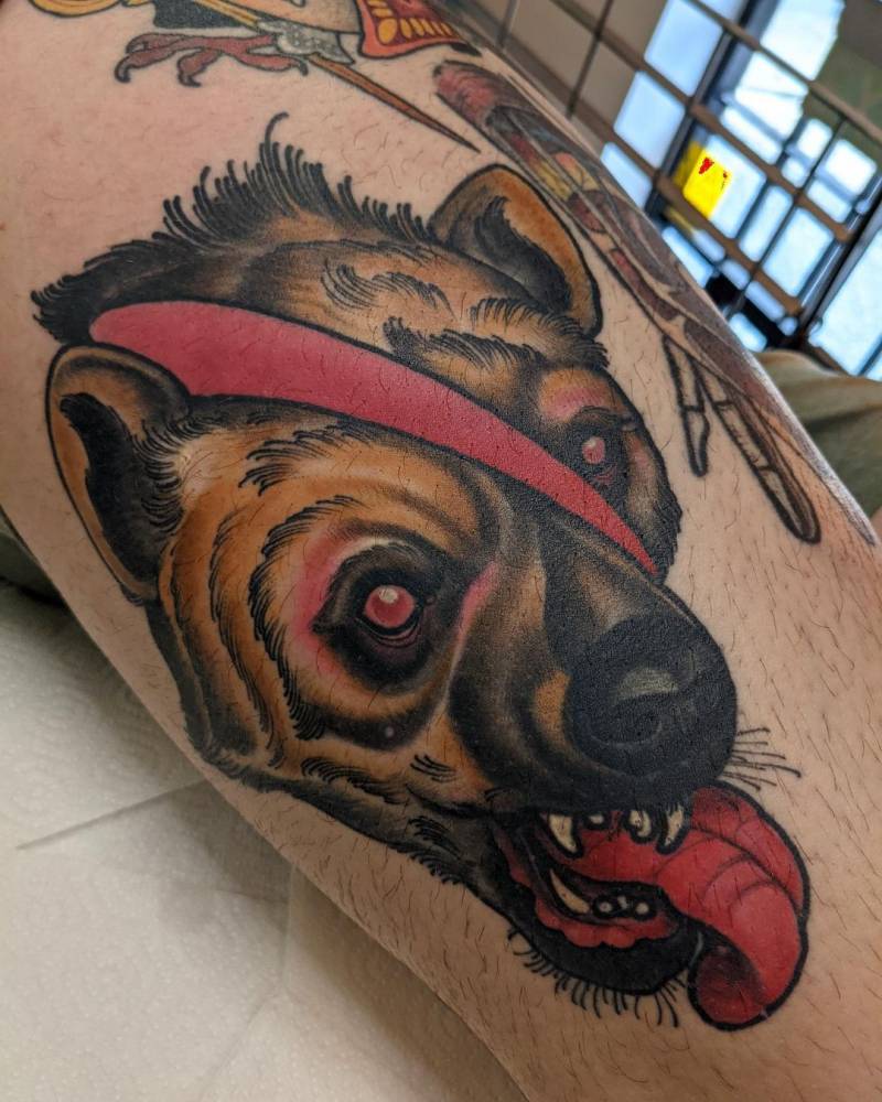 Healed hyena portrait tattoo located on the thigh.