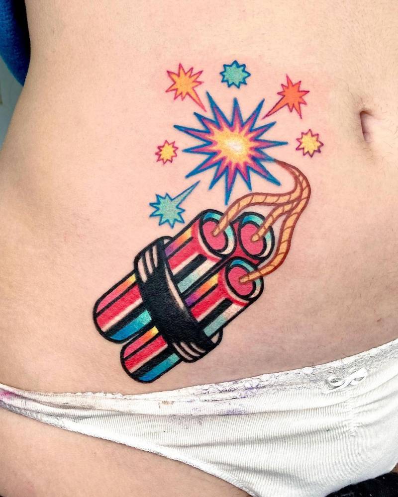 Dinamite tattoo located on the waist.