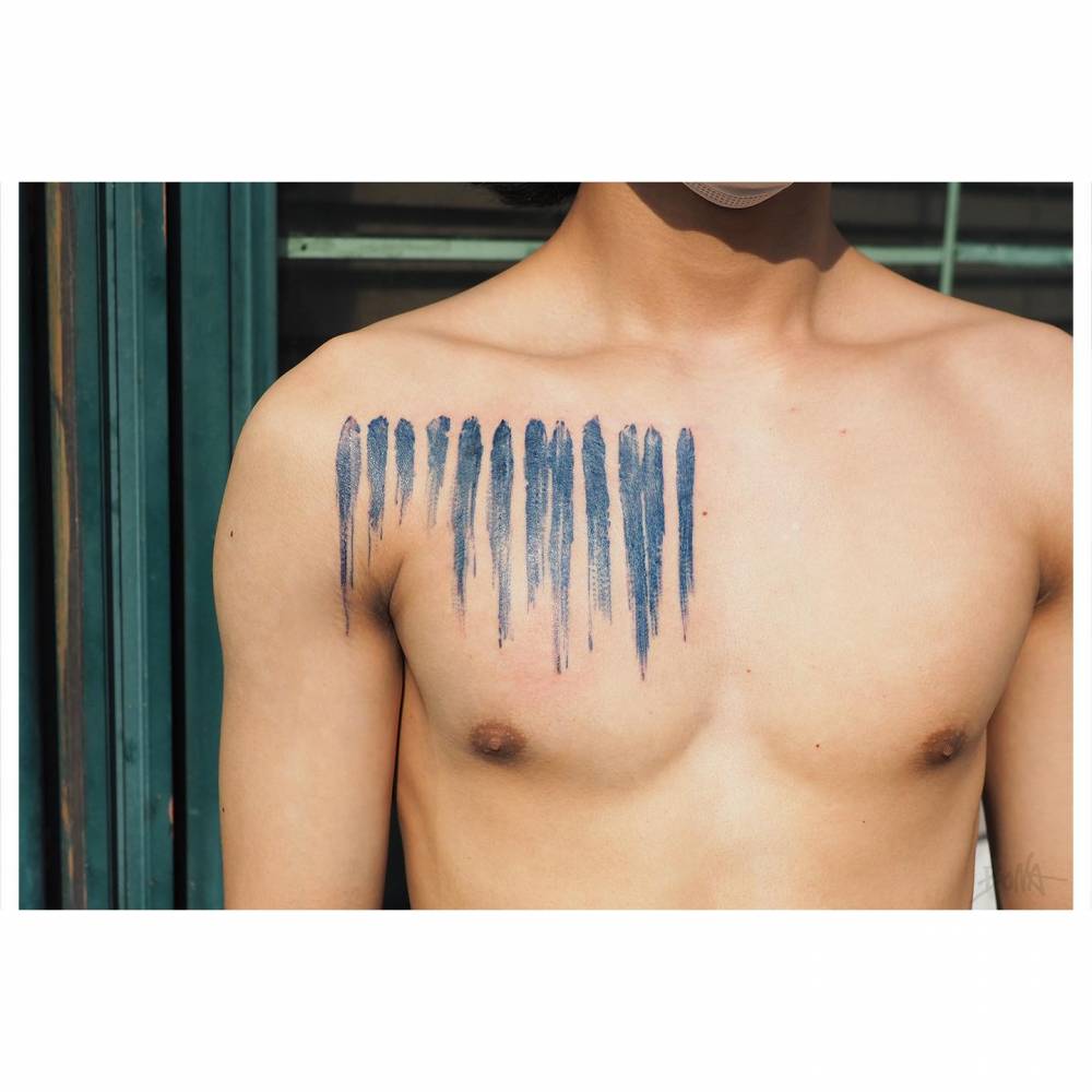 Lee Ufan's 'From Line' artwork tattooed on the chest.