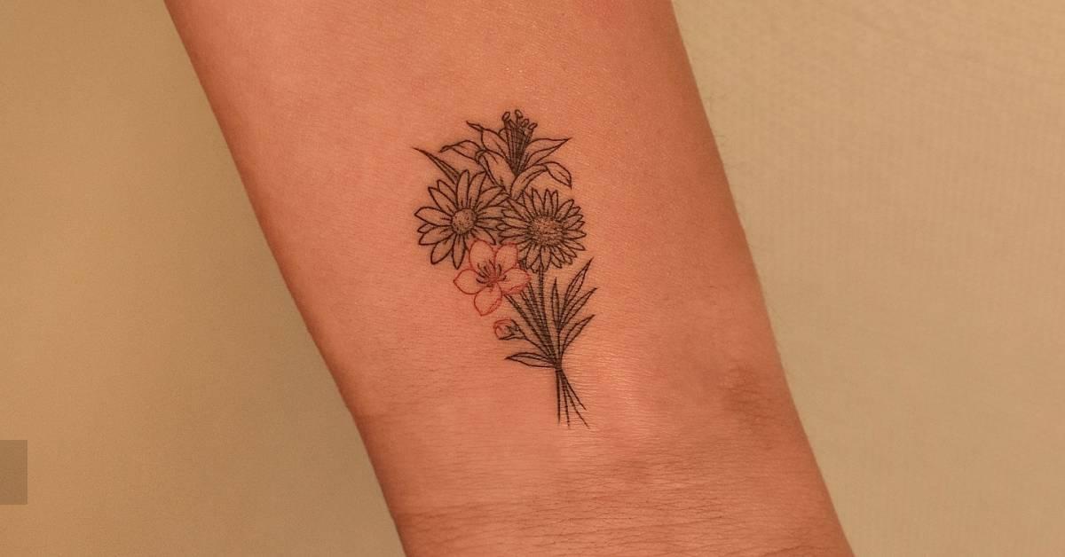 Fine line style flower bouquet tattoo located on the