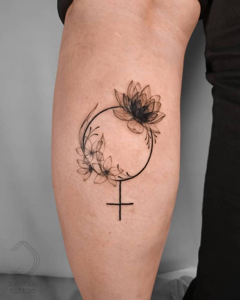 X-Ray effect floral Venus symbol tattoo located on the calf.