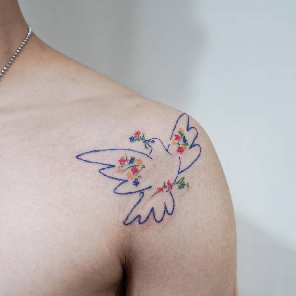 Picasso's Dove tattooed on the shoulder.